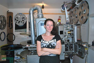 Photo by: Kari Curtis Leah Welch stands by the Empire Theatre’s 35mm projector.